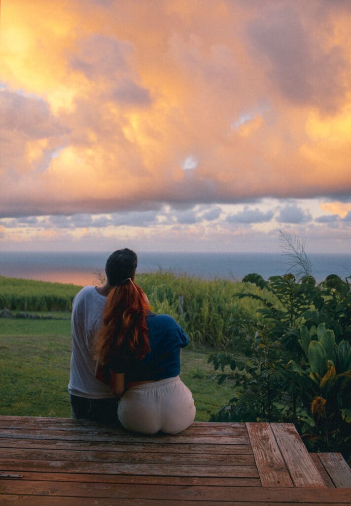 Couple watching sunset on Hawaii Big Island vacation